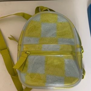 Cute bright colored mini plastic back pack.